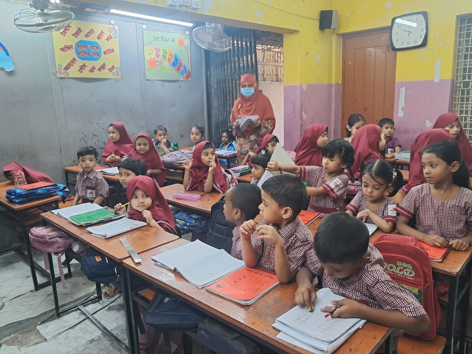 Children working through an exercise at their desks at Alor Path School