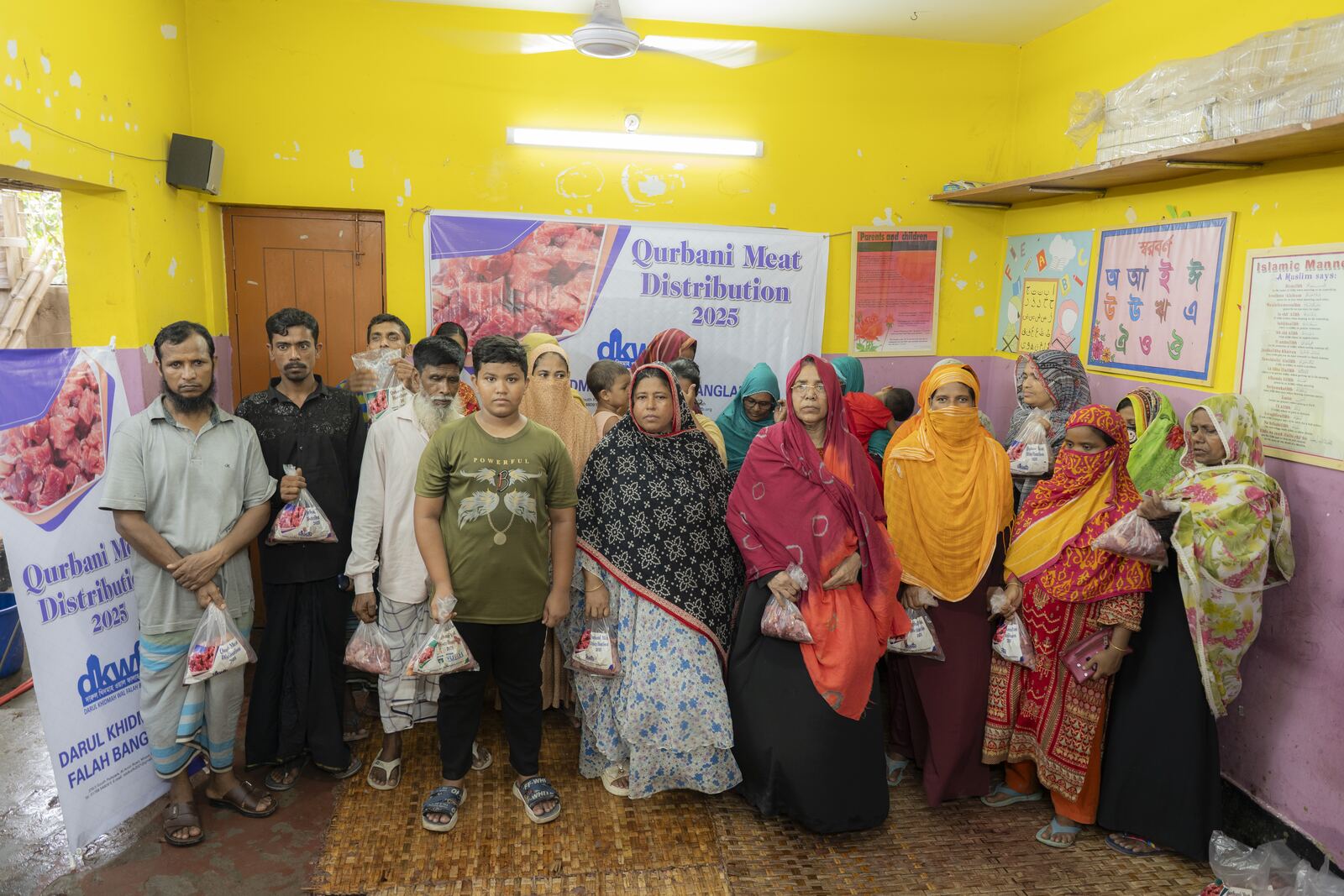 Cuts of Qurbani meat being weighed and packed for distribution